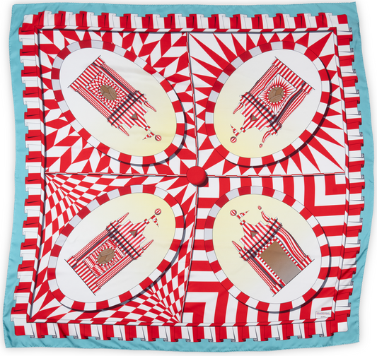 A square scarf laid out. The pattern is divided into quarters, each square depicting a red and white striped tent. Surrounding these tents are red and white patterns. There is a baby blue border around the outside of the scarf.