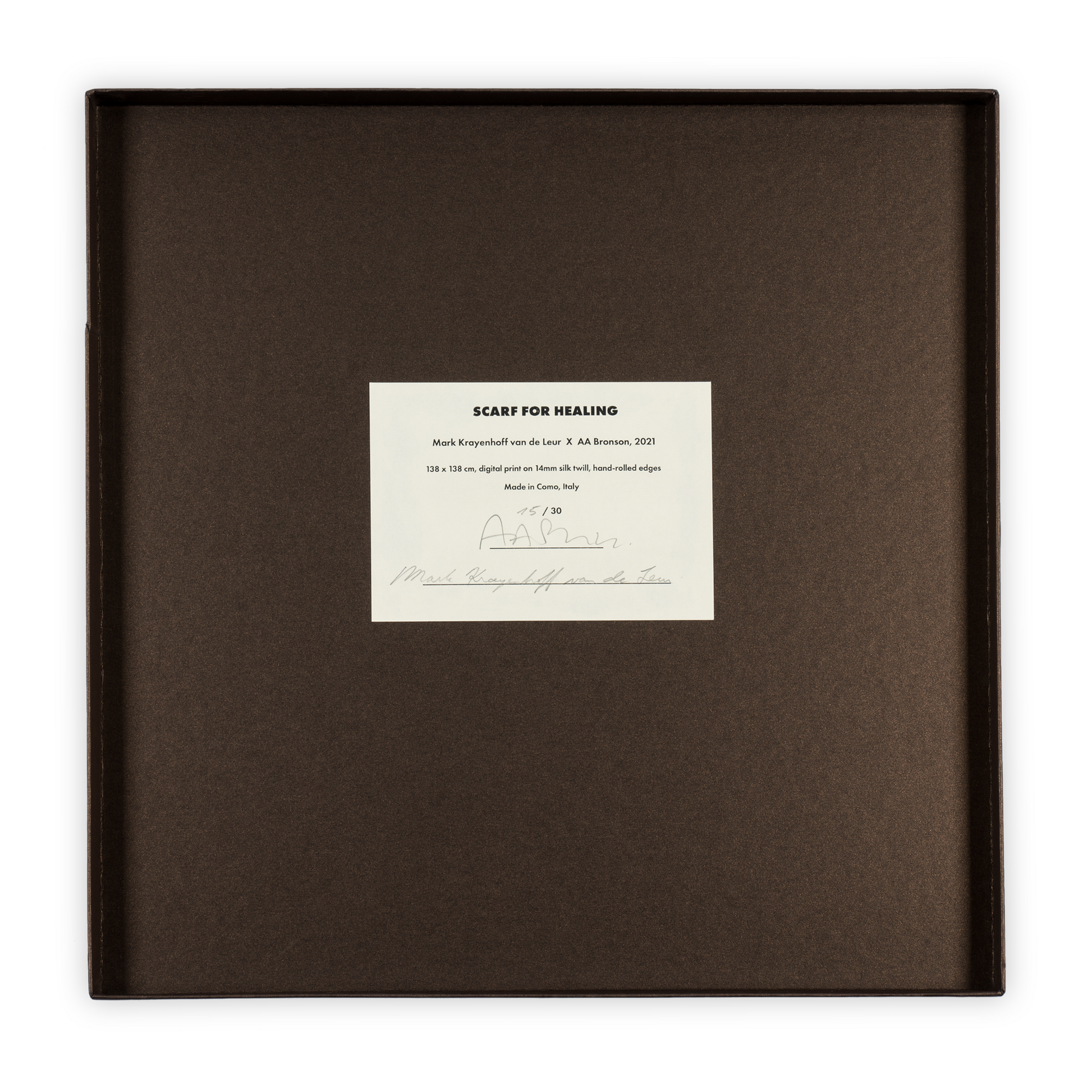 The inside of the scarf box, inculding a certificate of authenticity signed by AA Bronson.